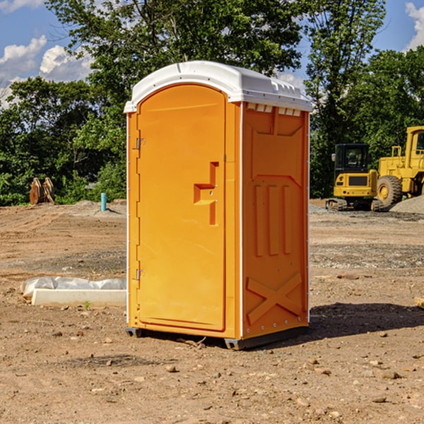 what is the cost difference between standard and deluxe portable restroom rentals in McAlmont